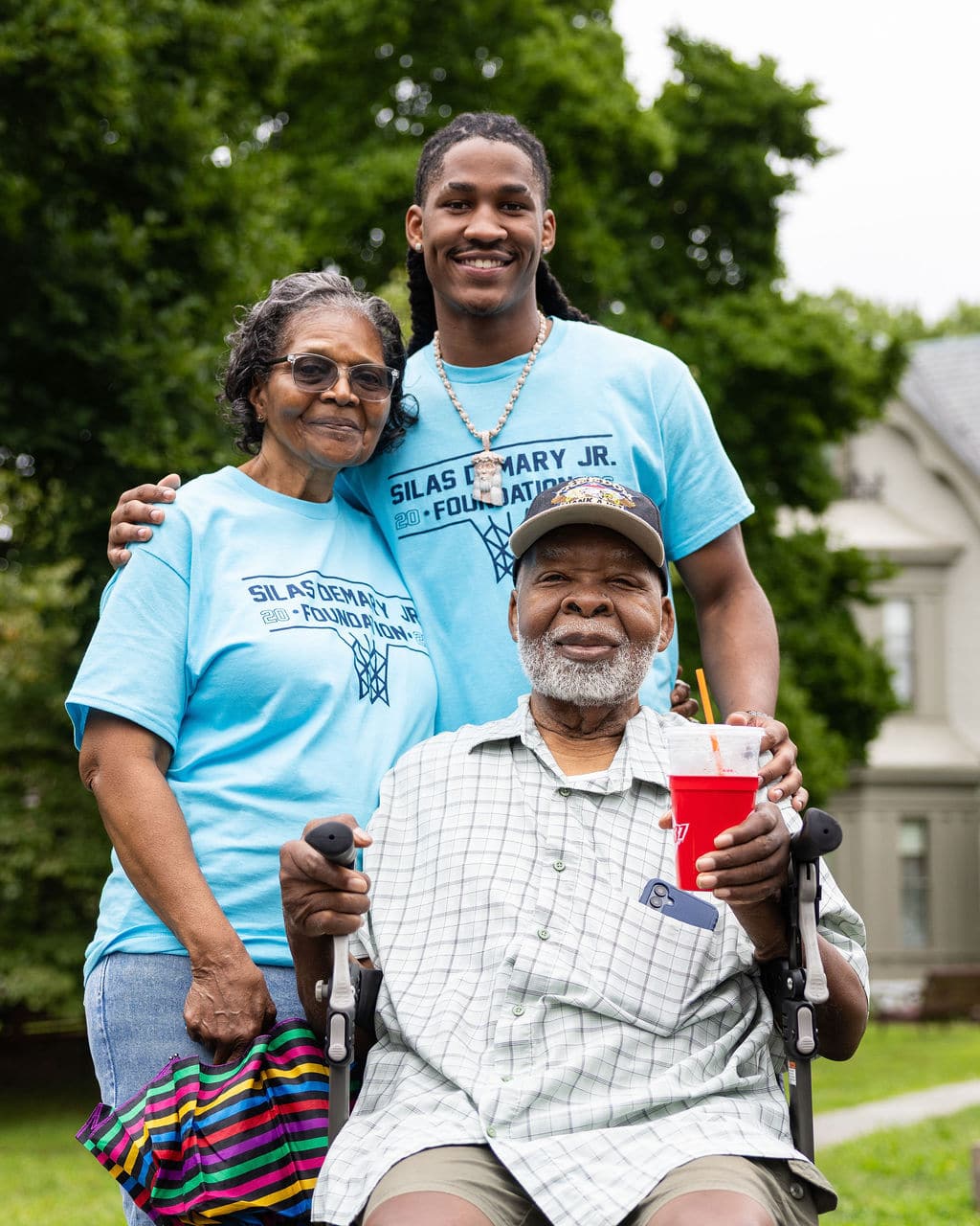 Silas Demary Jr. with his grandparents at the Hartford bash