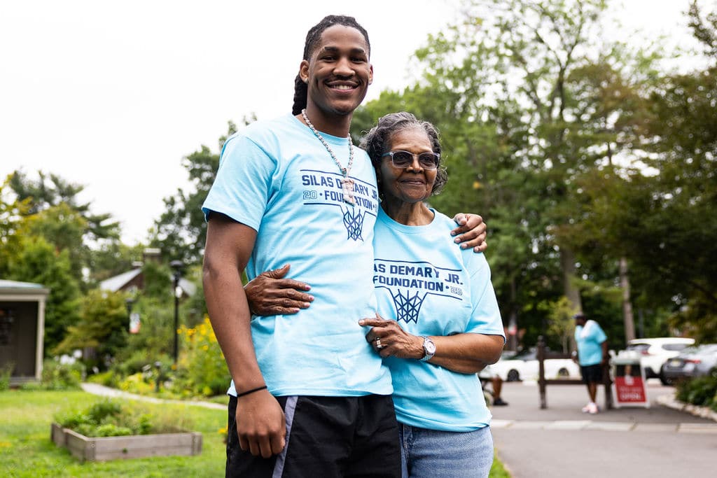 Silas Demary Jr. with his grandmother at the Hartford bash