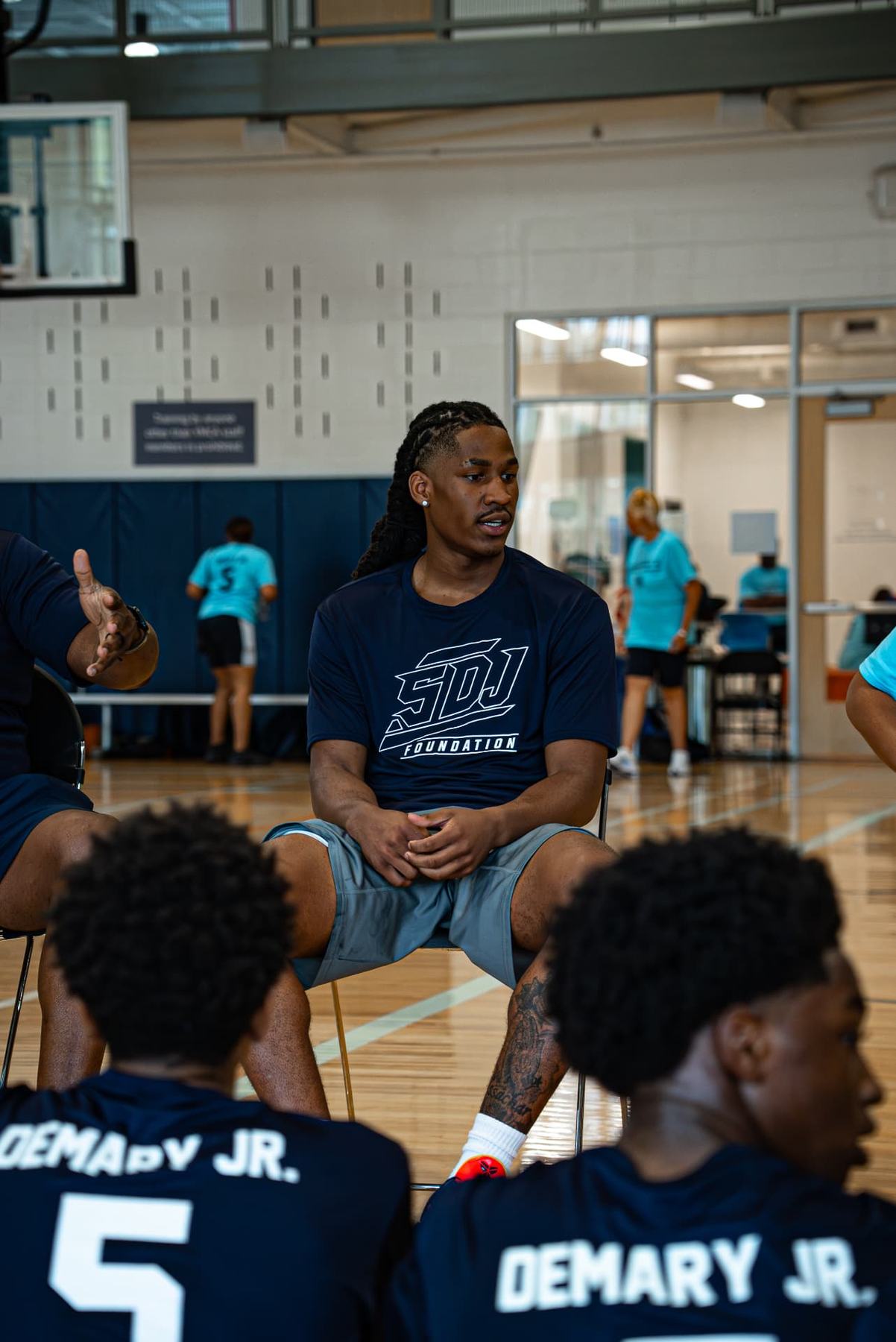 Silas Demary Jr. speaks with young players during the 2026 Raleigh basketball camp.
