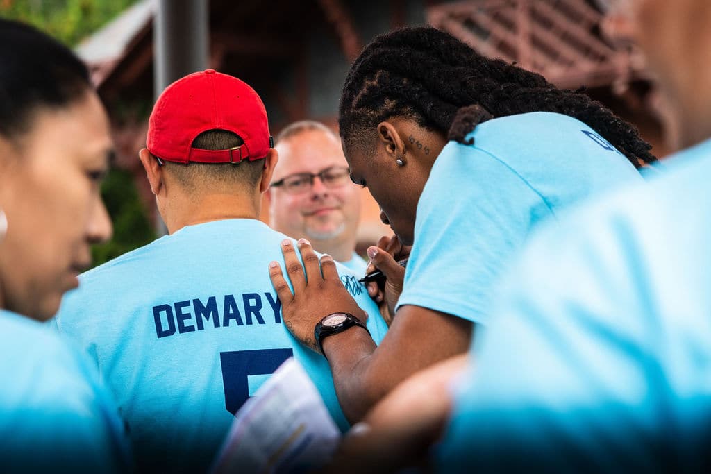 Silas Demary Jr. signing a shirt for a guest at the bash