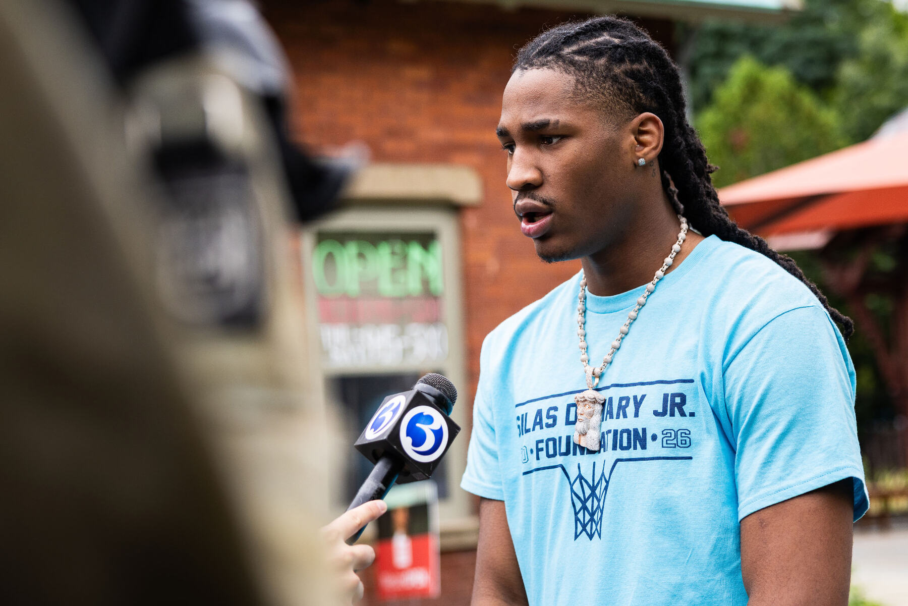 Silas Demary Jr. being interviewed by WFSB Channel 3 at the bash