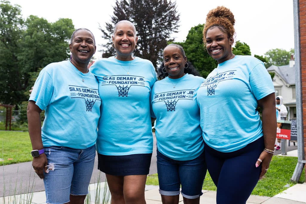 Foundation volunteers in Silas Demary Jr. Foundation shirts