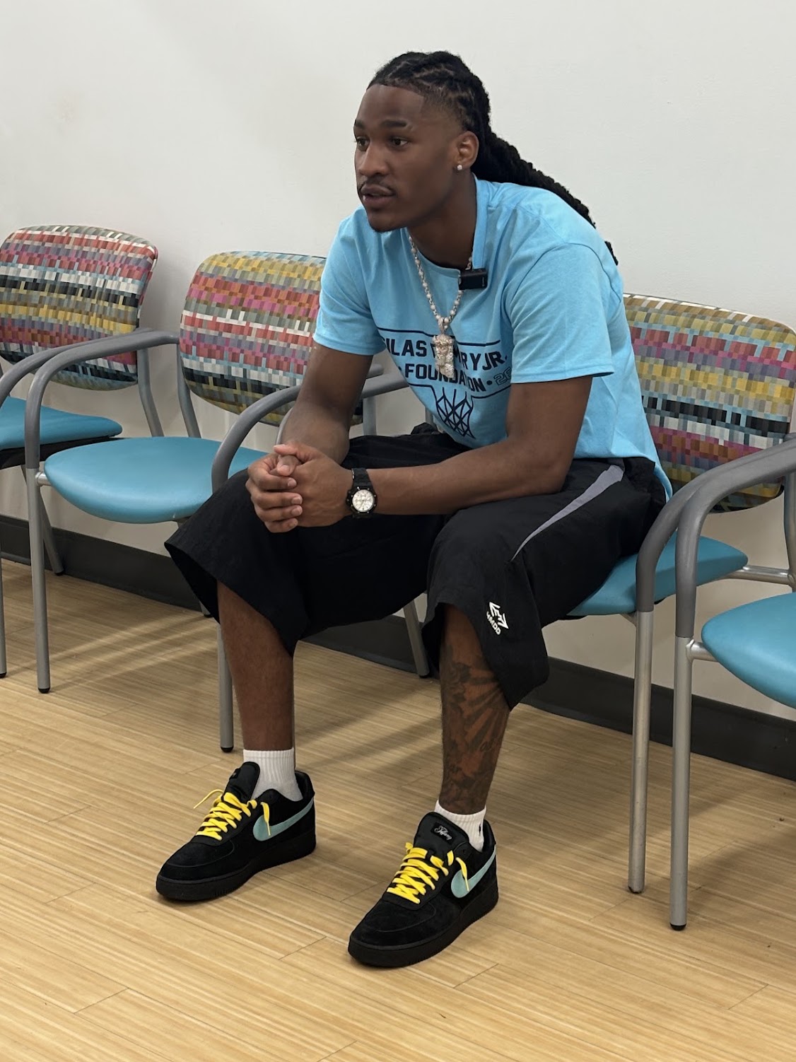 Silas Demary Jr. sits and talks with participants during the 2026 Raleigh Back to School Bash.