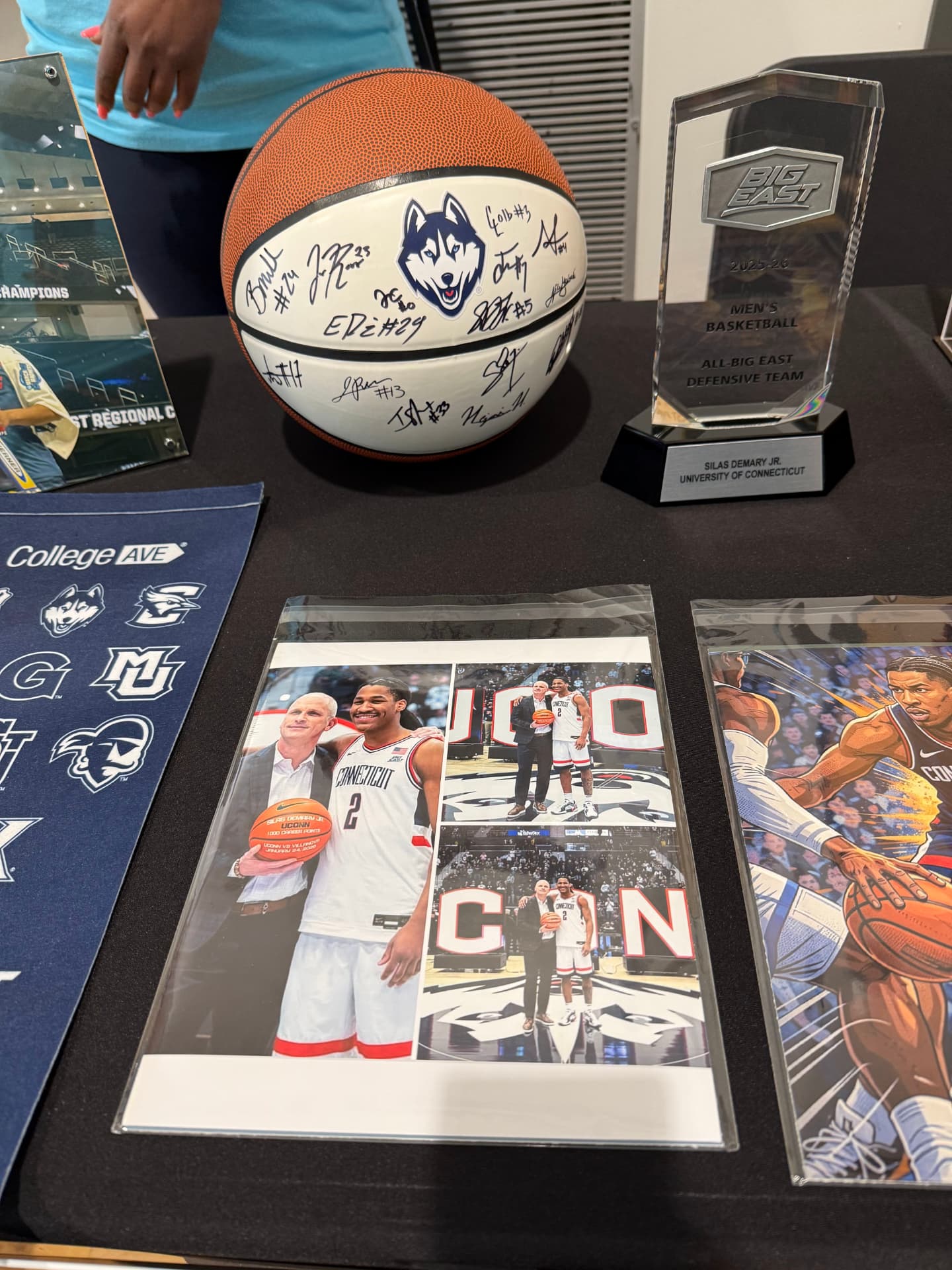 A signed UConn basketball and the Big East All-Defensive Team award honor Silas Demary Jr.'s college career.