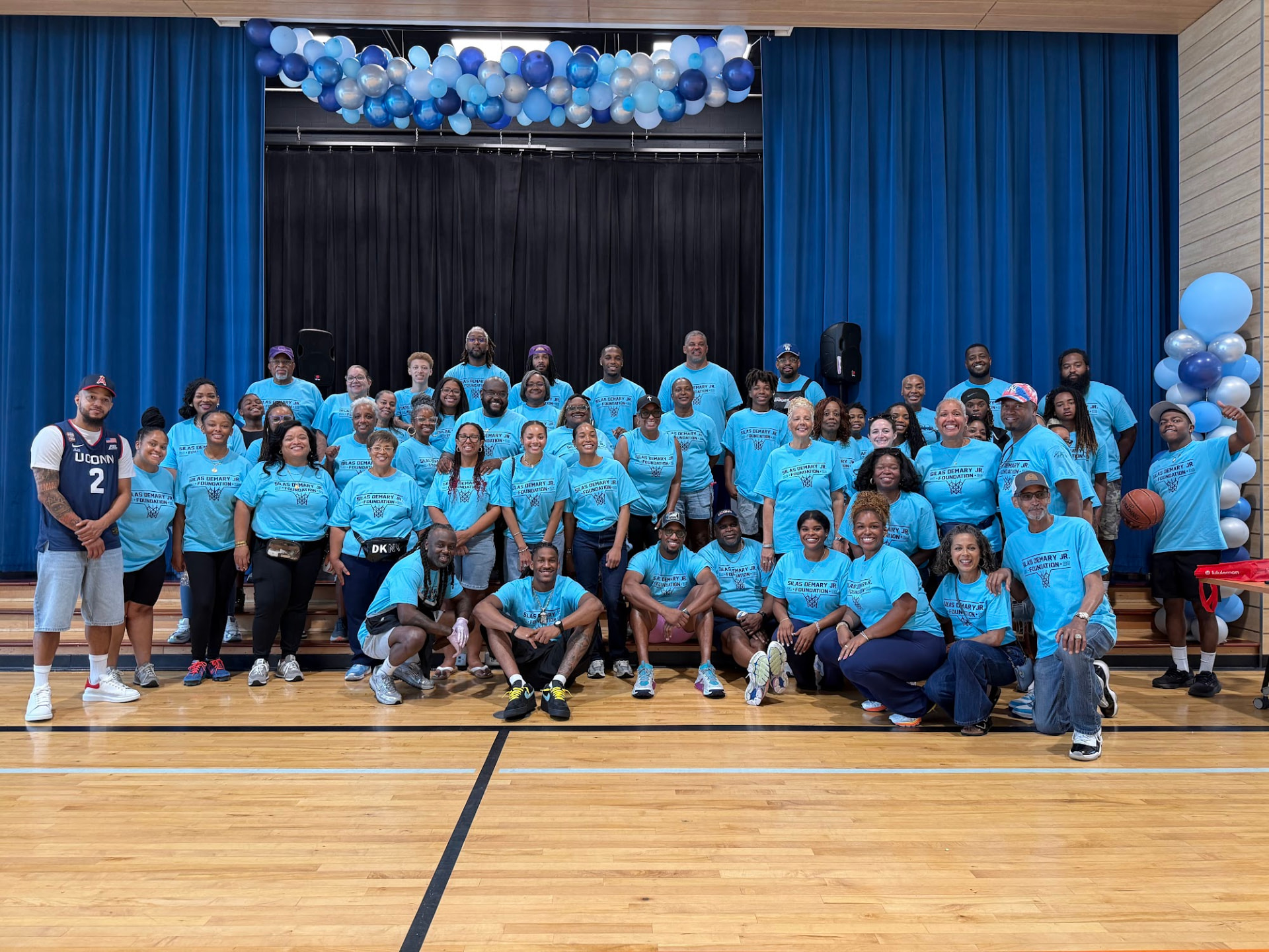 Foundation volunteers and community members pose for a group photo at the 2026 Raleigh Back to School Bash.