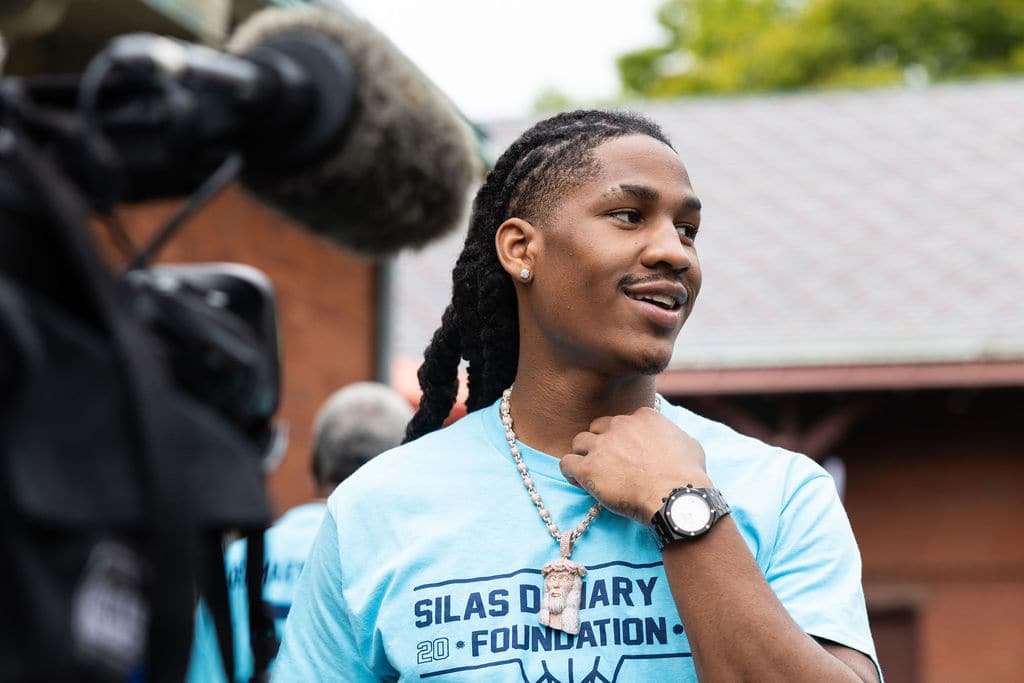 Silas Demary Jr. smiling between interviews at the bash